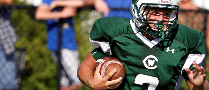 West Catholic Football Carry